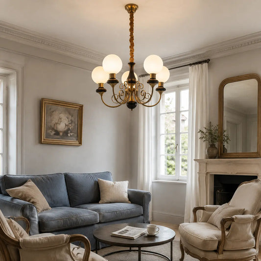Black Sylvie five-light chandelier centred above a living room conversation area